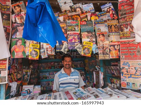 BANGALORE, INDIA - CIRCA OCTOBER 2013: Magazine and newspaper stand in old town. The language of most magazines is Kannada, the language of Karnataka State, of which Bangalore is the capital.