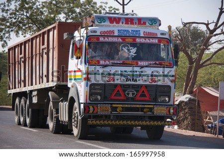 NAGAUR, INDIA - CIRCA FEBRUARY 2011: Decorated and painted heavy dump truck on the road in India.