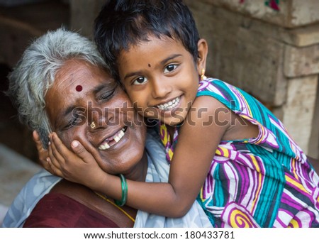 THIRUVANNAMALAI, INDIA - CIRCA OCTOBER 2013: The love between grandmother and granddaughter.