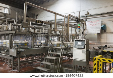 BAVIKHOVE, BELGIUM - CIRCA MARCH 2014: Automated keg rinsing and filling machine with four lines at Brewery De Brabandere.