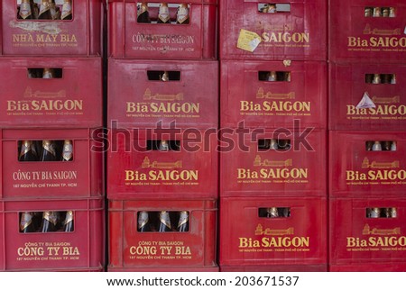 HO CHI MINH CITY, VIETNAM - CIRCA APRIL 2012: Stack of crates with \'Saigon\' beer bottles. Red wall of crates with yellow words spelled on them.