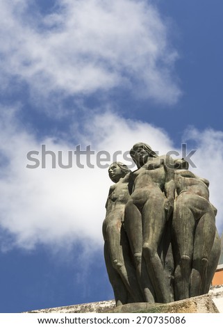 SAN JUAN, PUERTO RICO - MARCH 8, 2015: Part of the La fuente la Herencia de las Americas statue group. Naked female bodies against a blue sky with a few white clouds.