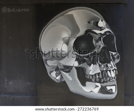 SAN JUAN, PUERTO RICO - MARCH 13, 2015: Graffiti in Tras Talleres neighborhood. Very sharp black and white image of a skull with a metallic look and feel.