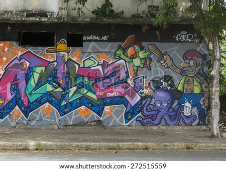 SAN JUAN, PUERTO RICO - MARCH 13, 2015: Graffiti in Tras Talleres neighborhood. Very sharp image of a group of cartoon pirates, including parrot and octopus. All seem to in attack mode.