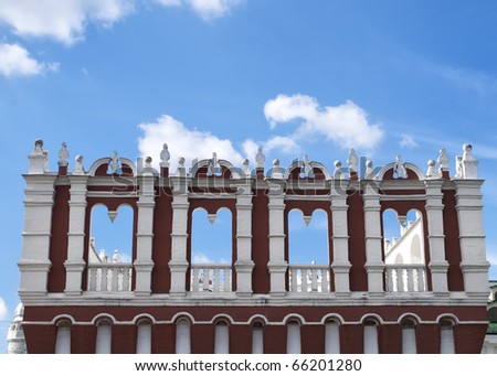 Blue sky peeps through window gates on watch tower of Kremlin.