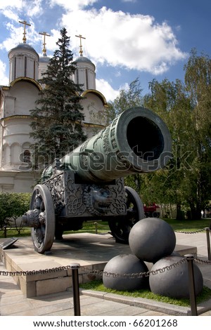 Historic cannon and balls in front of a church at the Kremlin. War and Peace united at the Kremlin.