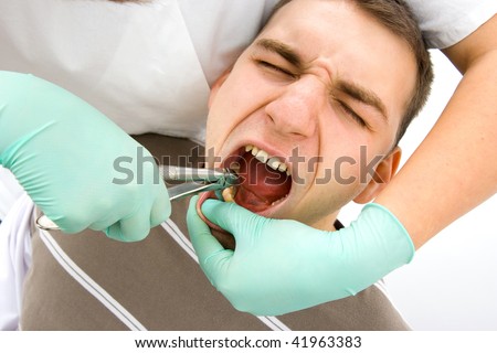 patient at the dentist - tooth extraction