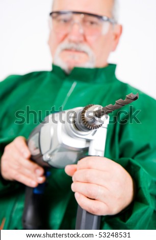 Construction worker holding the electric hand drill