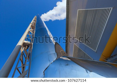 Steam from the boiler tubes in a blue sky