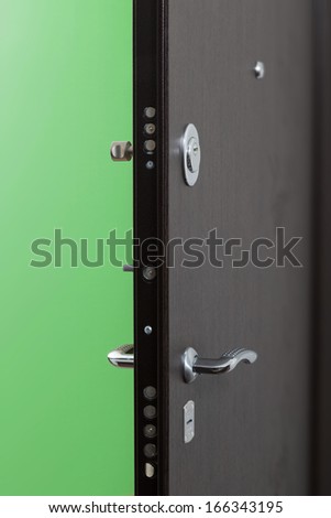 Front metal door with a powerful lock in new apartment