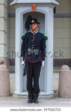 OSLO,NORWAY - JUNE 14: Royal Guard guarding Royal Palace on June 14, 2015 in Oslo, Norway.His Majesty the King's Guard keeps The Royal Palace and the Royal Family guarded for 24 hours a day