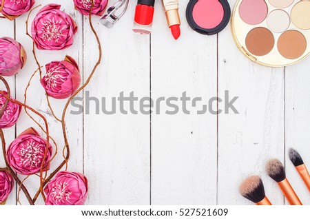 Makeup Cosmetics and Pink Lotus on White Wooden Background, Flat Lay Style with Free Text Space