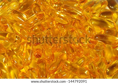 Omega-3 fish fat oil capsules background