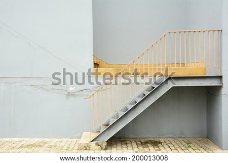 Steel stair with blue wall background