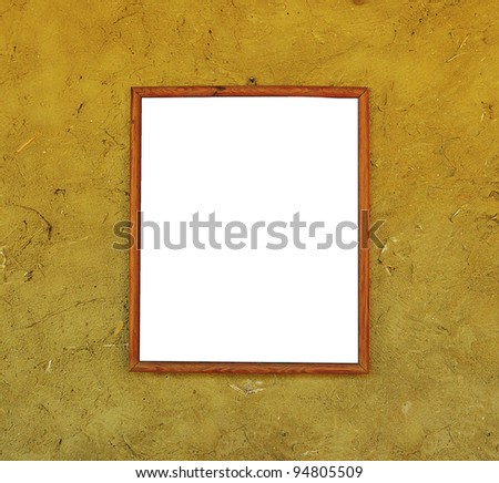 wood frame on the cracked wall made of orange clay and straw background