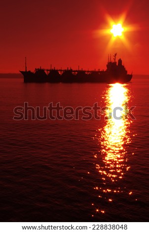 silhouette tanker on the background of the setting sun