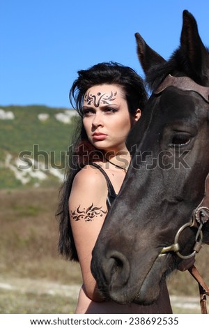 girl-warrior - Amazon with a black horse