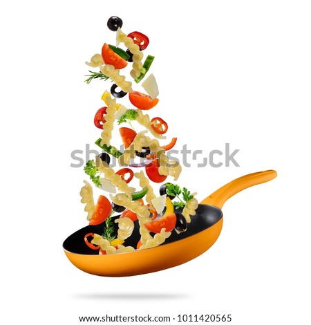 Concept of flying food preparation with traditional italian pasta and vegetable in pan. Isolated on white background. Very high resolution image