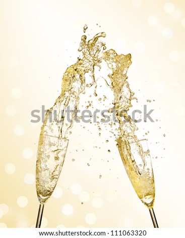 Splashing champagne out of glasses, concept of celebration