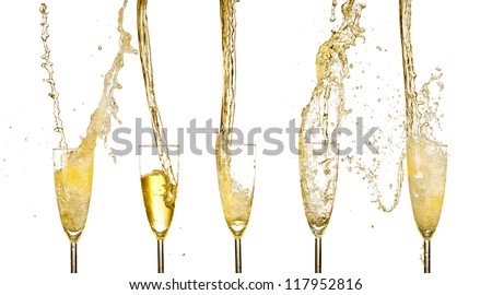 Collection of champagne wine glasses splashing out