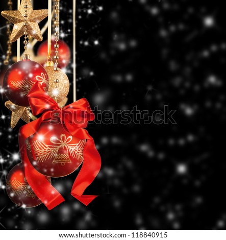 Christmas theme with red glass balls on black background