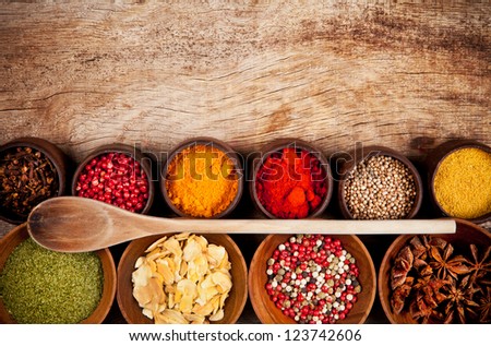 Various Kind Of Spices In Wooden Bowls