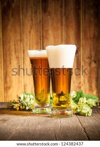 Glass of beers on wooden table