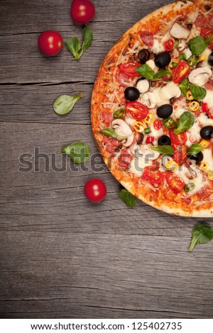 Delicious italian pizza served on wooden table