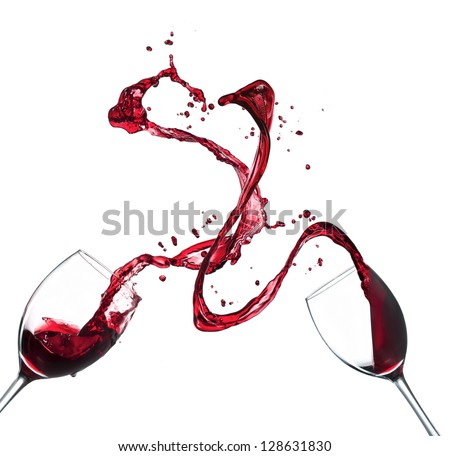 Concept of red wine splashing from glasses, isolated on white background