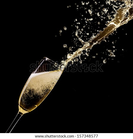 Glass Of Champagne With Splash, Isolated On Black