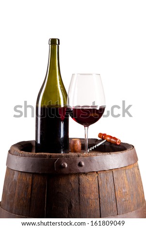 Red wine on wooden keg isolated on white background