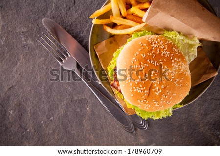 Fresh hamburger on stone, view from top