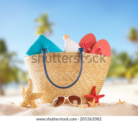 Summer concept with swimming accessories and blur sea on background