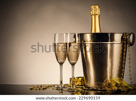 Champagne bottle with glasses. Celebration theme with champagne still life