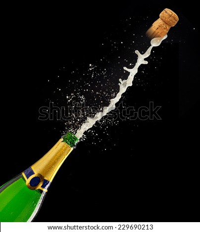 Bottle of champagne with splash on black background