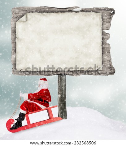 Empty wooden board with copy-space for text with Santa Claus on sledge