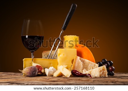 Various kind of cheese with red wine