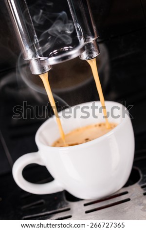 Detail of coffee machine making espresso