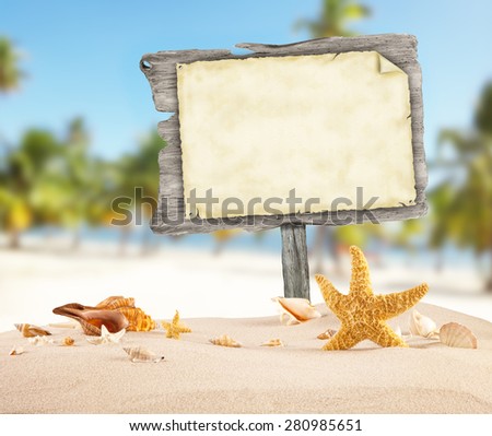 Summer beach with shells, stars and blank wooden poster. Blur azure sea on background