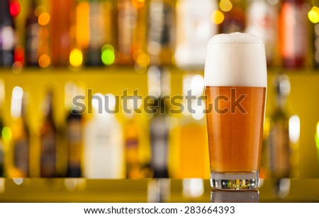 Jug of beer placed on bar counter with free space for text