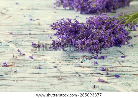 Lavender blossoms on wood