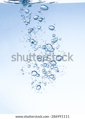 Macro photo of abstract shape of bubbles in water