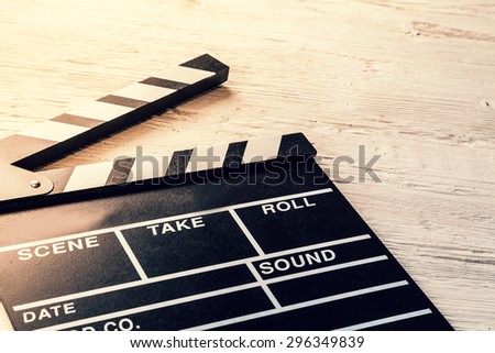 Film camera chalkboard placed on wooden table