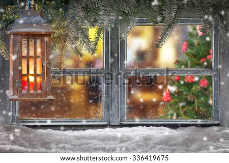 Atmospheric Christmas window sill decoration with home cozy interior. Christmas tree on background