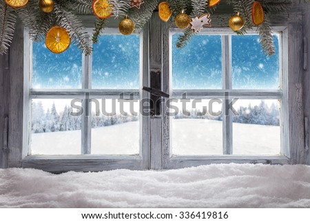 Vintage wooden window overlook winter landscape, shot from cottage interior