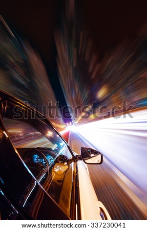 Car driving at night city with blur motion