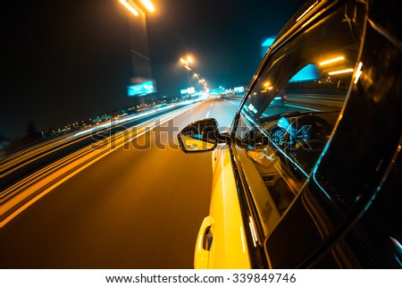 Car driving at night city with blur motion