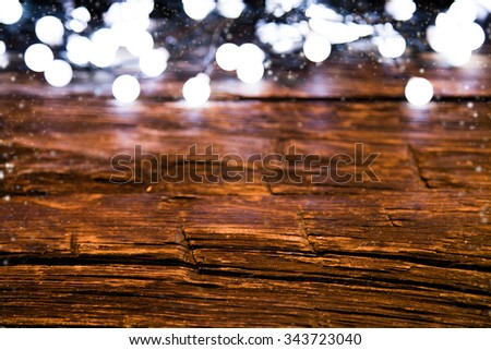 Blur christmas lights on wooden planks, low depth of focus with copyspace
