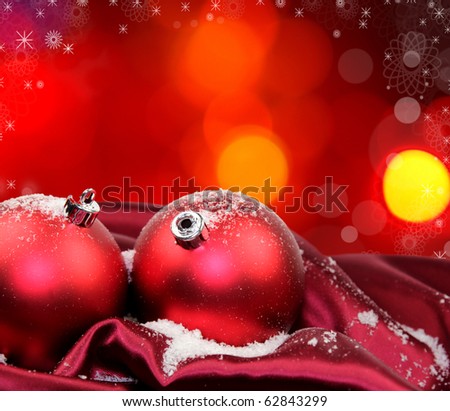 Christmas background with red glass balls in soft fabric silk