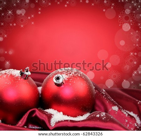 Christmas background with red glass balls in soft fabric silk